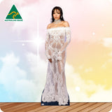 A woman models a floor-length off-the-shoulder lace gown with long sheer sleeves and a fitted silhouette, standing against a pastel sky background with a wooden floor. An Australian Made logo appears in the top-left corner.