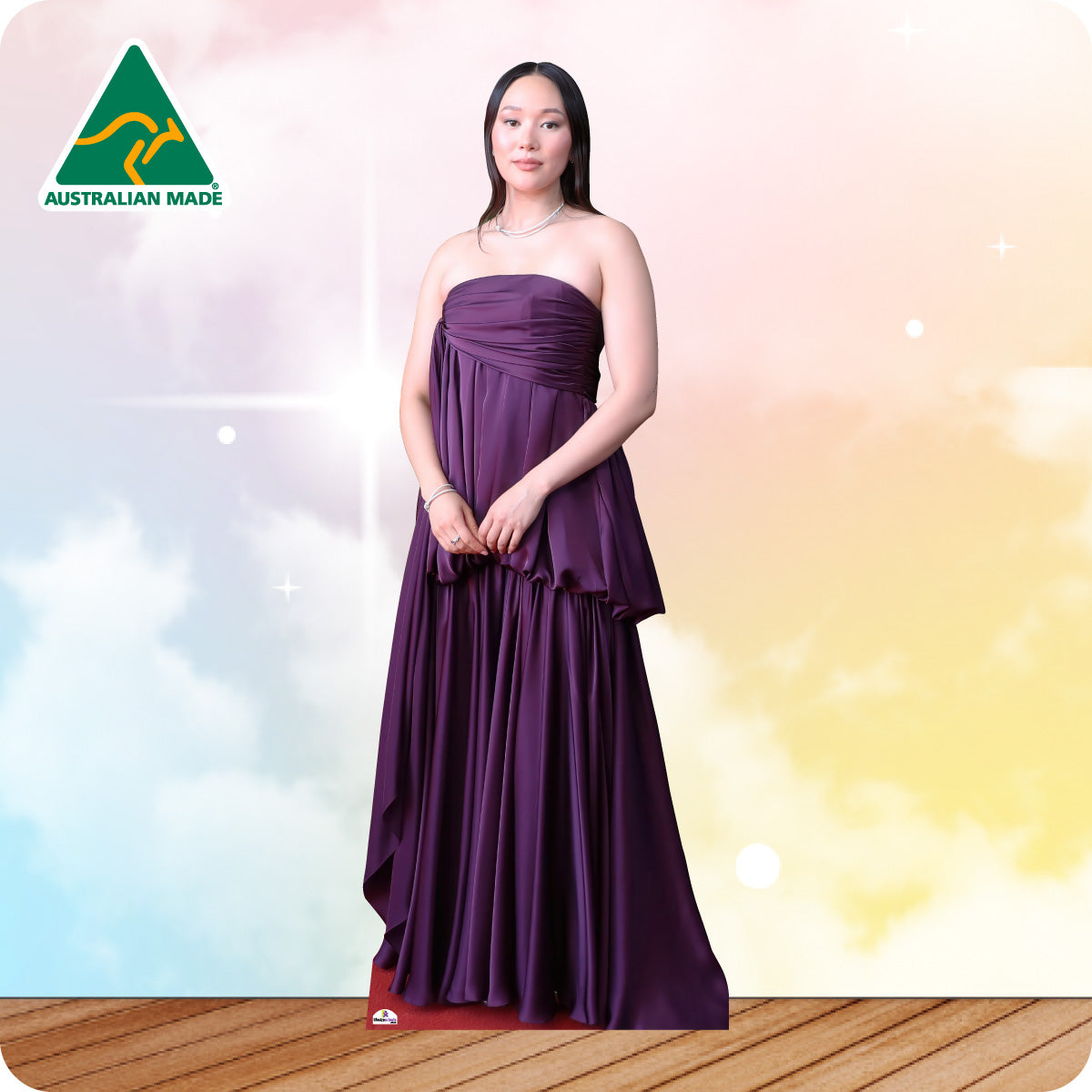 Woman wearing a purple strapless gown against a gradient background with 'Australian Made' logo.