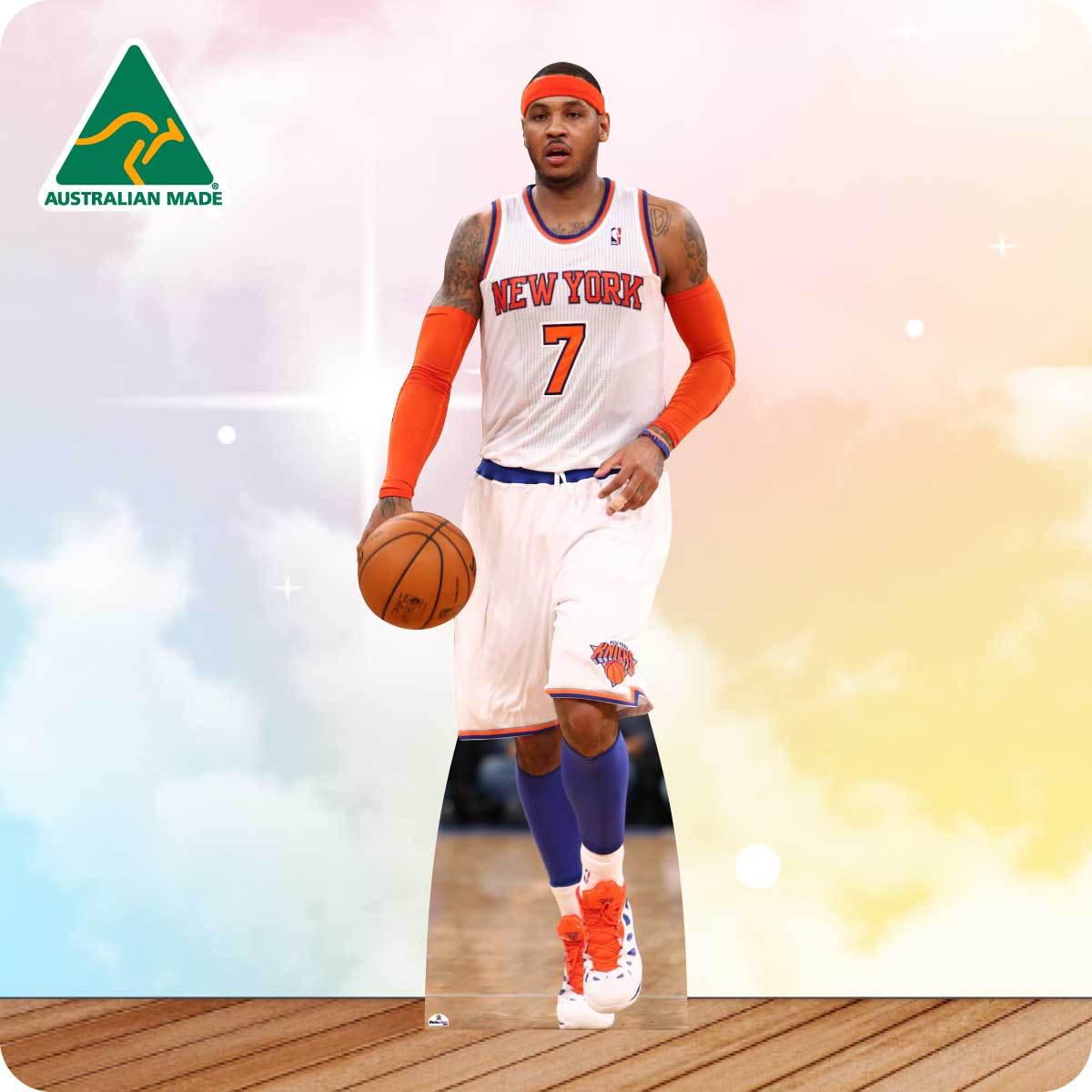 Basketball player in a New York Knicks jersey holding a basketball on a colorful background with 'Australian Made' logo.
