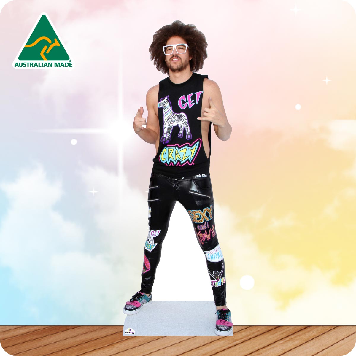 Life-size Redfoo cutout wearing a black hat, oversized sunglasses, leopard print jacket, black trousers and trainers.