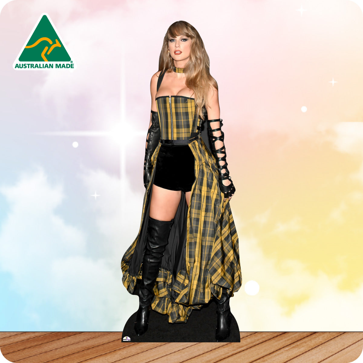 Cardboard cutout of a person wearing a plaid dress and black boots with 'Australian Made' logo.